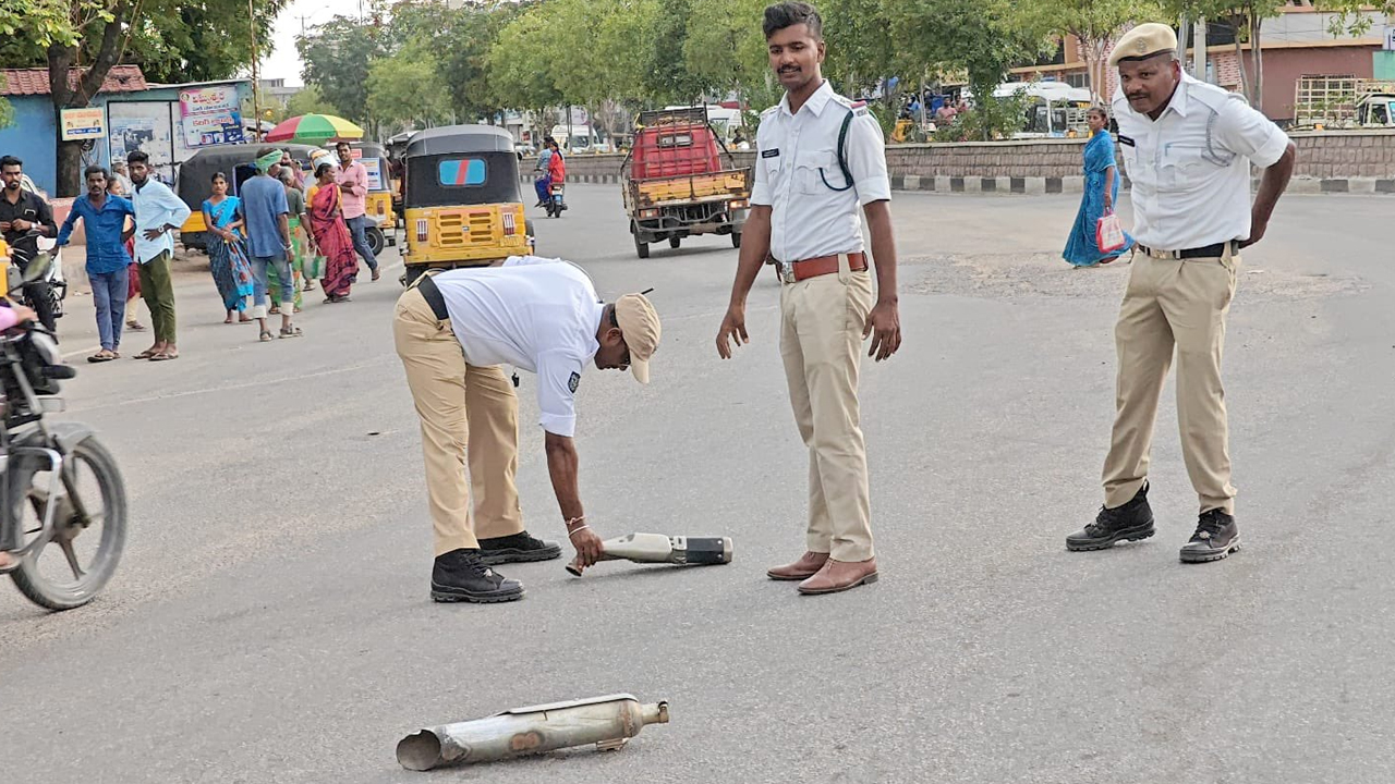 modified silencers crushed by road roller in Sircilla