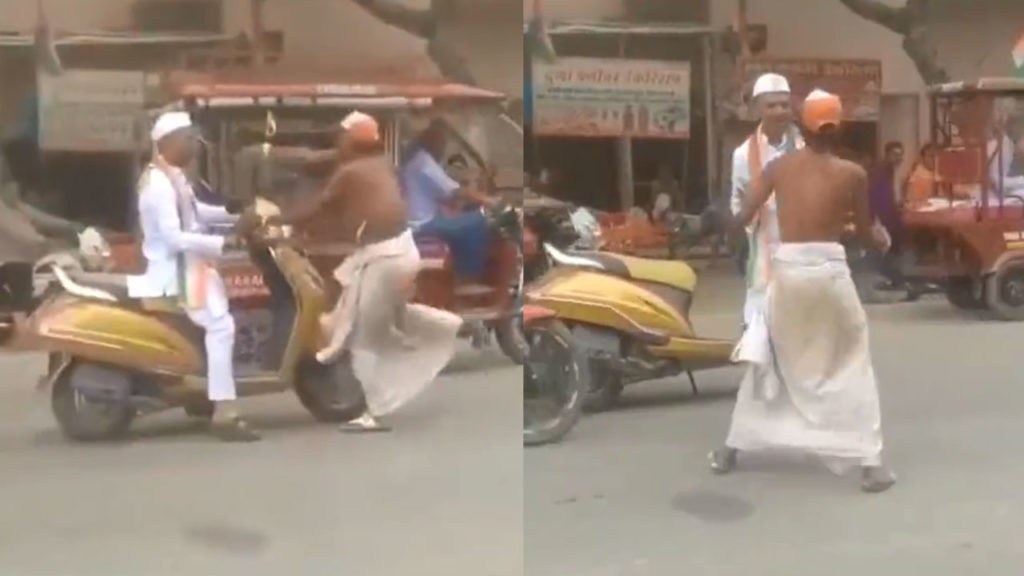An old man on a scooty was stopped and teased by a drunk on Independence Day