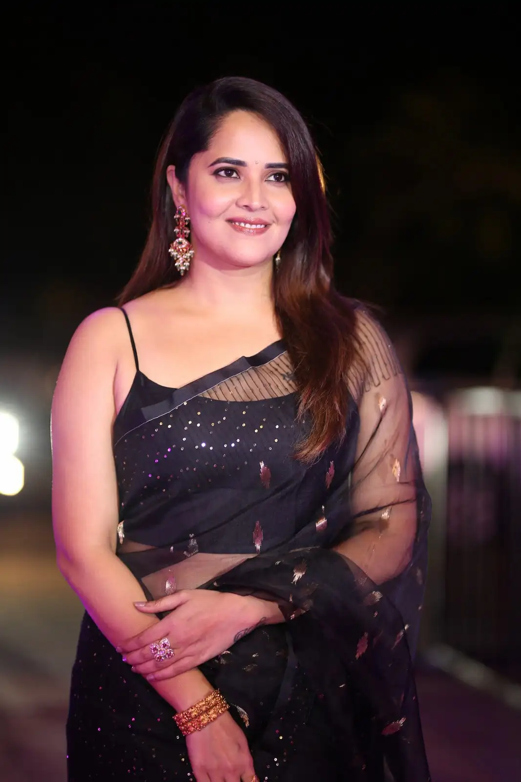 Anasuya Shines in Black Saree at Peddha Kapu 1 Pre Release Event