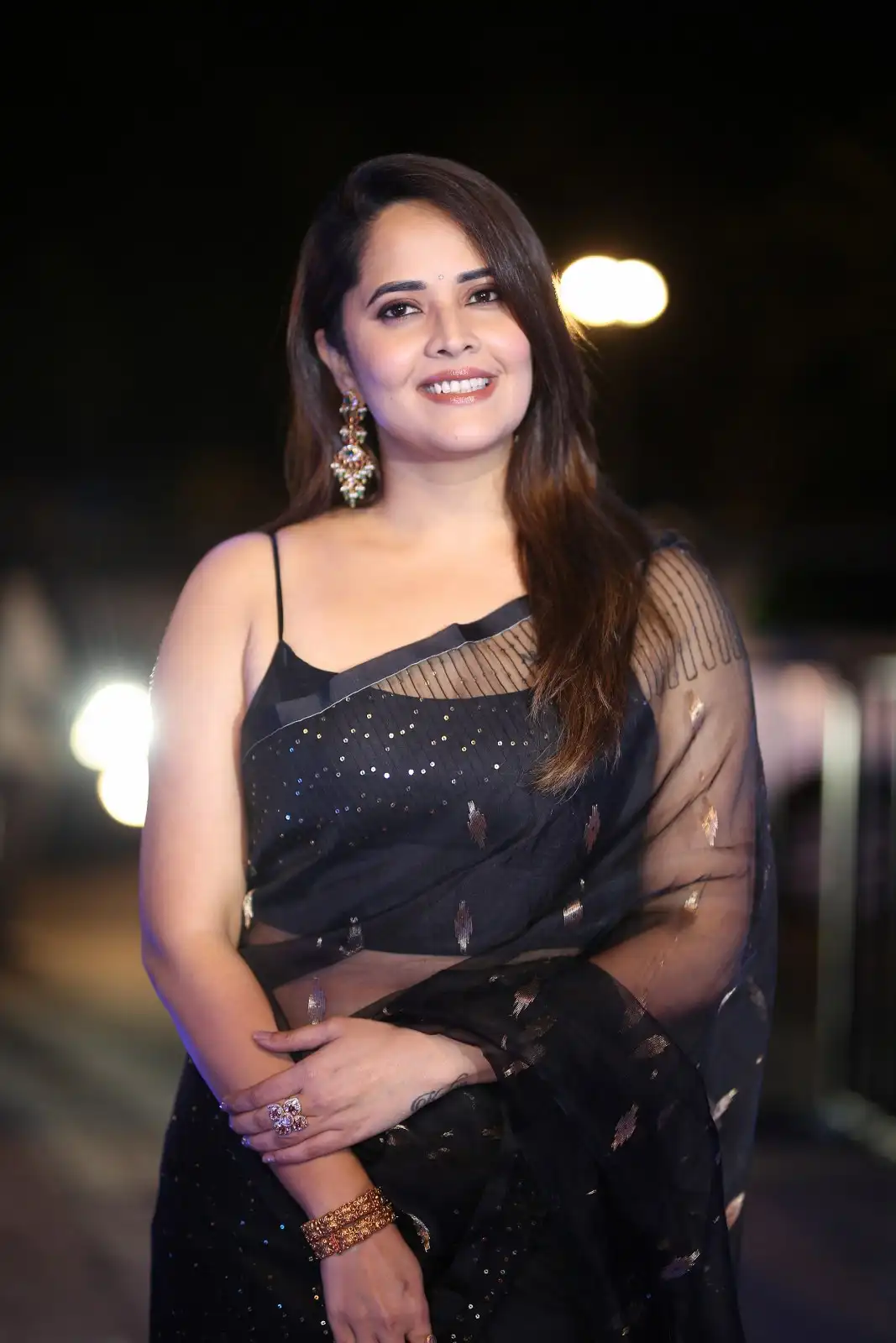 Anasuya Shines in Black Saree at Peddha Kapu 1 Pre Release Event
