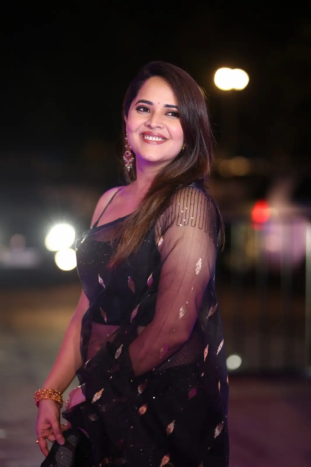 Anasuya Shines in Black Saree at Peddha Kapu 1 Pre Release Event