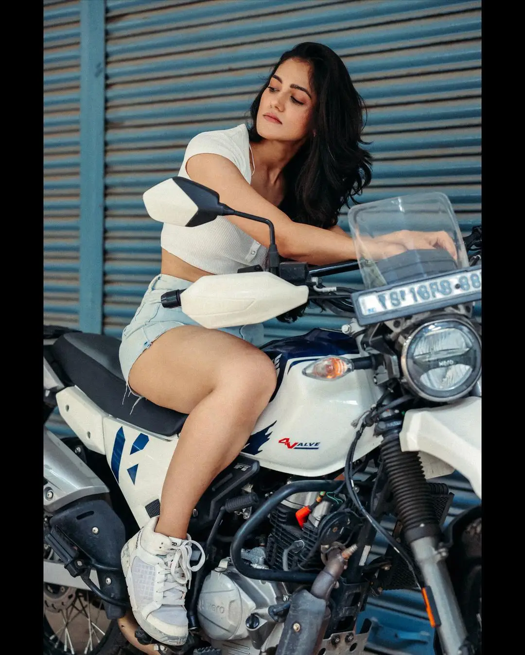 Simran Choudhary Stylish Poses on Bike with Short Dress