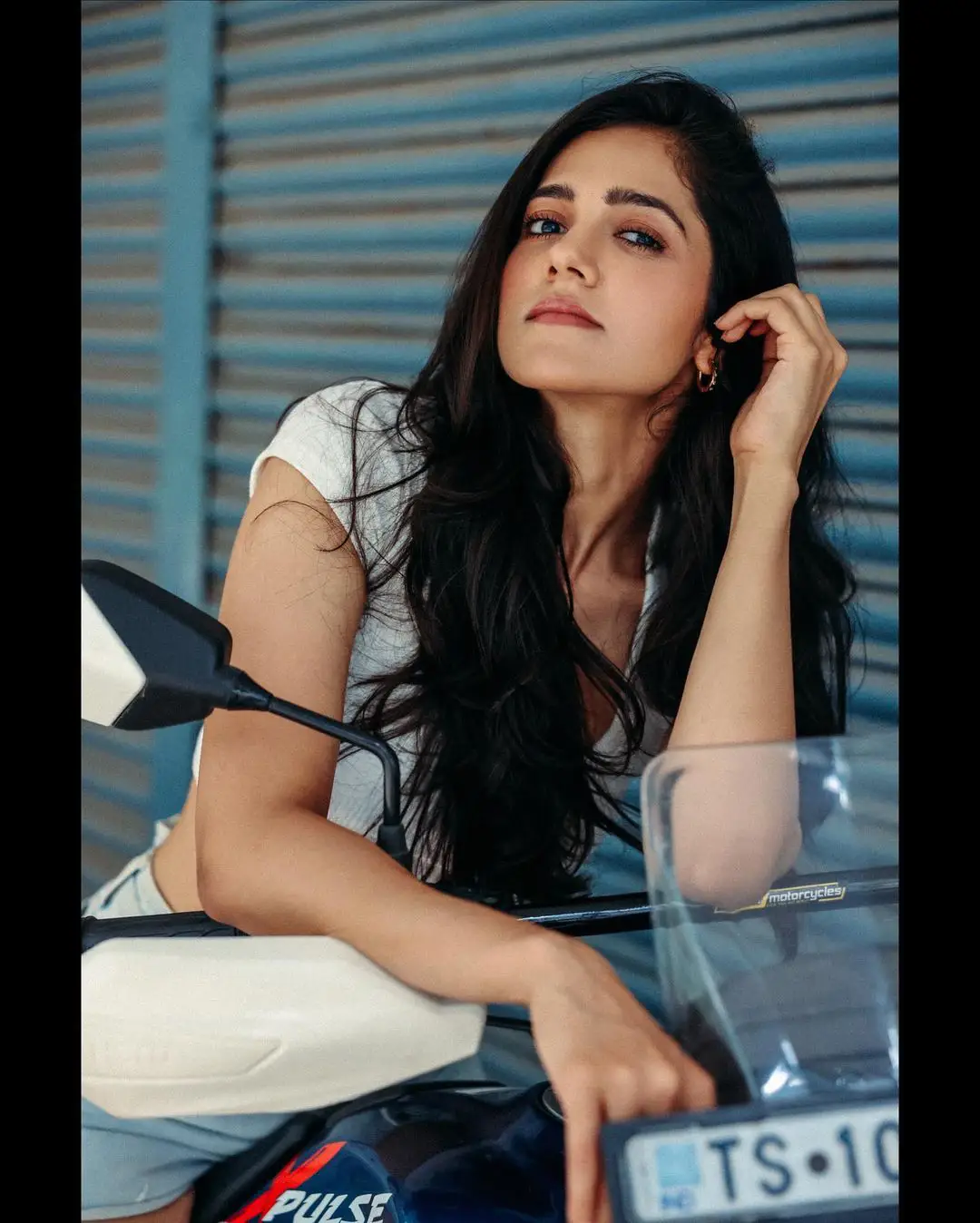 Simran Choudhary Stylish Poses on Bike with Short Dress