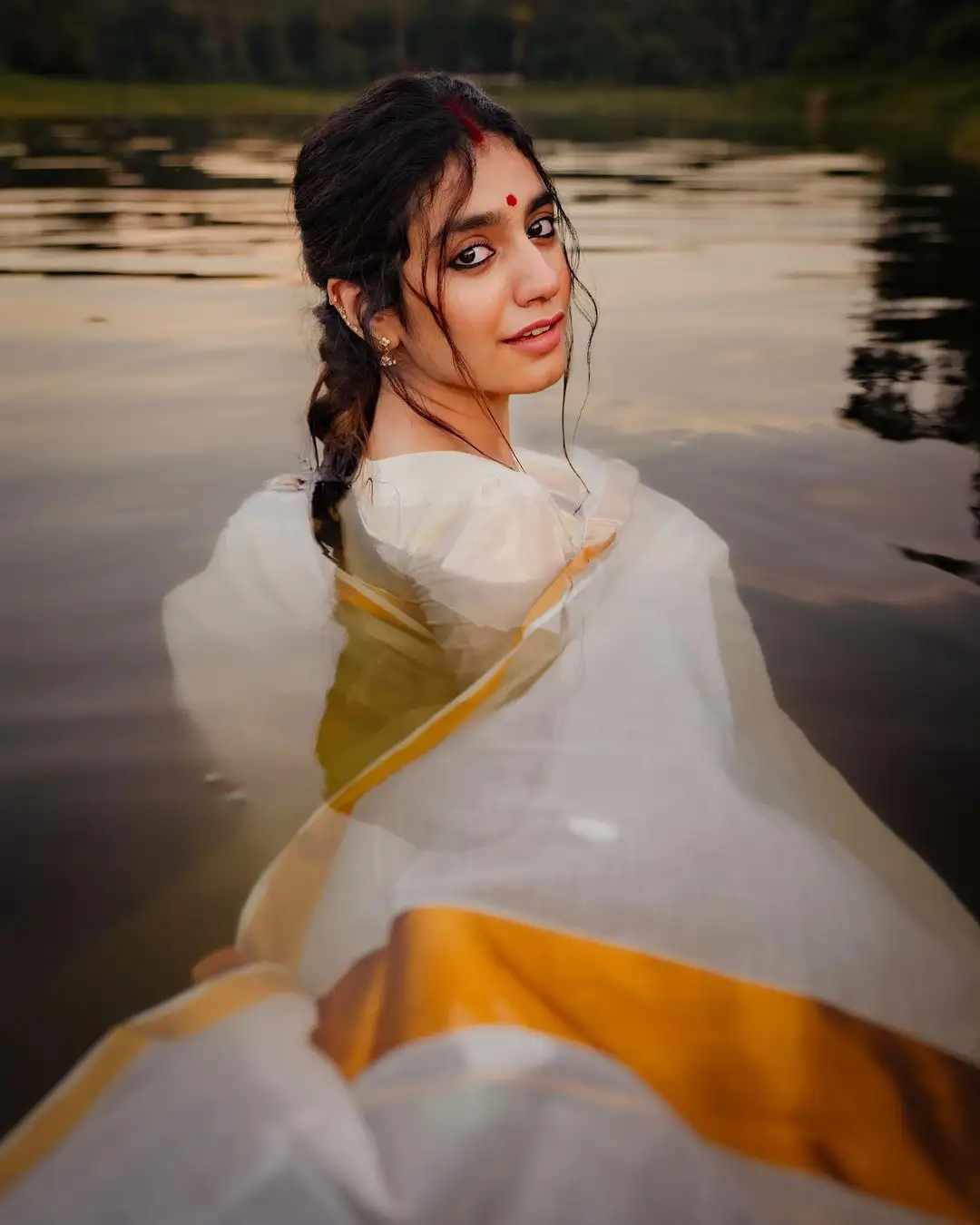 Priya Prakash Varrier Mesmerizing Saree Stills in Pond