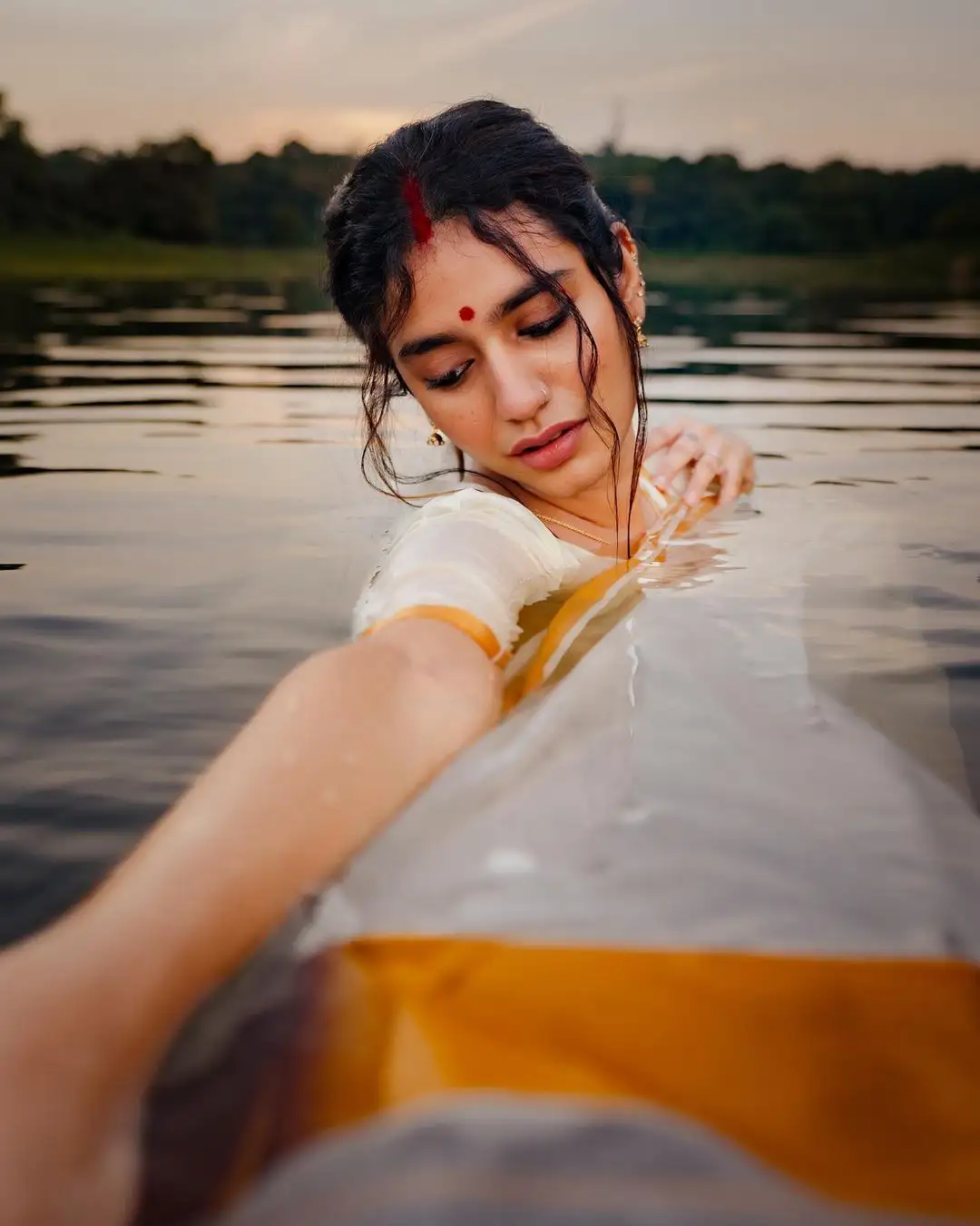Priya Prakash Varrier Mesmerizing Saree Stills in Pond