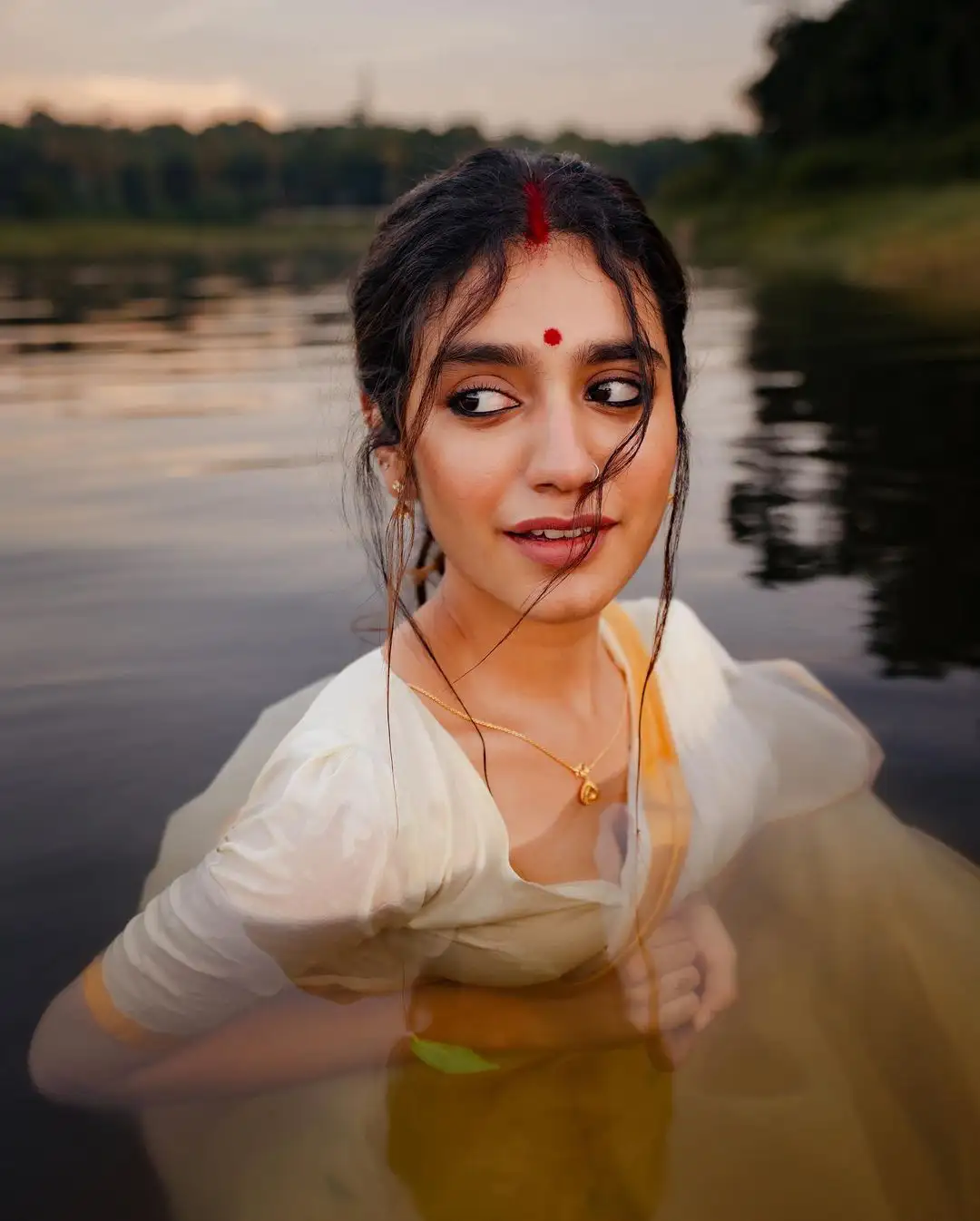 Priya Prakash Varrier Mesmerizing Saree Stills in Pond