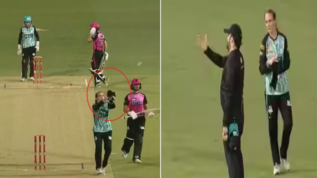 Amelia Kerr catches ball with towel