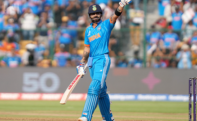 Virat Kohli celebrates his half-century