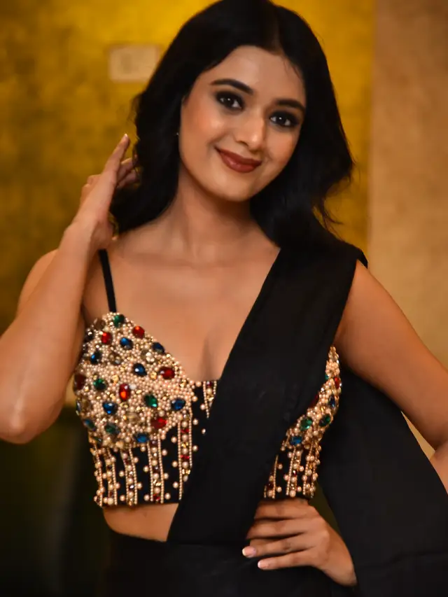 Neha Solanki Stunning Looks in Black Saree at Game On Pre Release Event