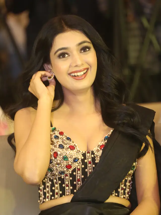 Neha Solanki Stunning Looks in Black Saree at Game On Pre Release Event
