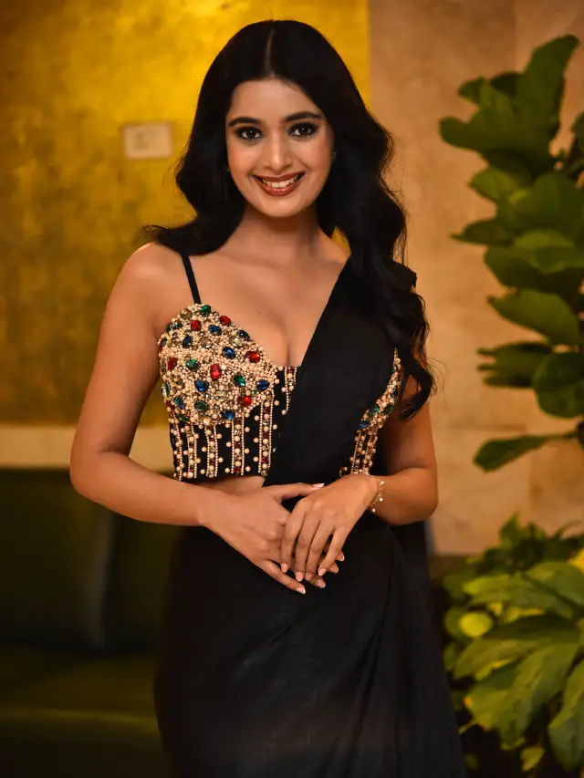Neha Solanki Stunning Looks in Black Saree at Game On Pre Release Event