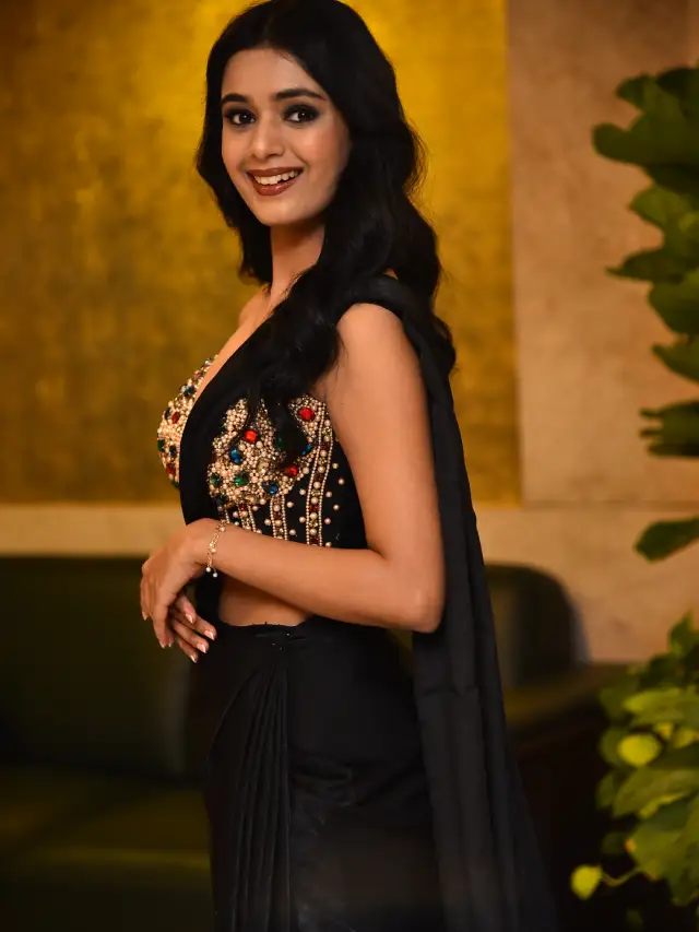 Neha Solanki Stunning Looks in Black Saree at Game On Pre Release Event