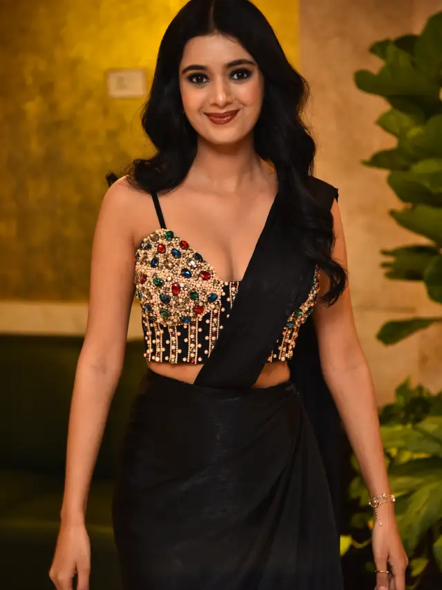 Neha Solanki Stunning Looks in Black Saree at Game On Pre Release Event