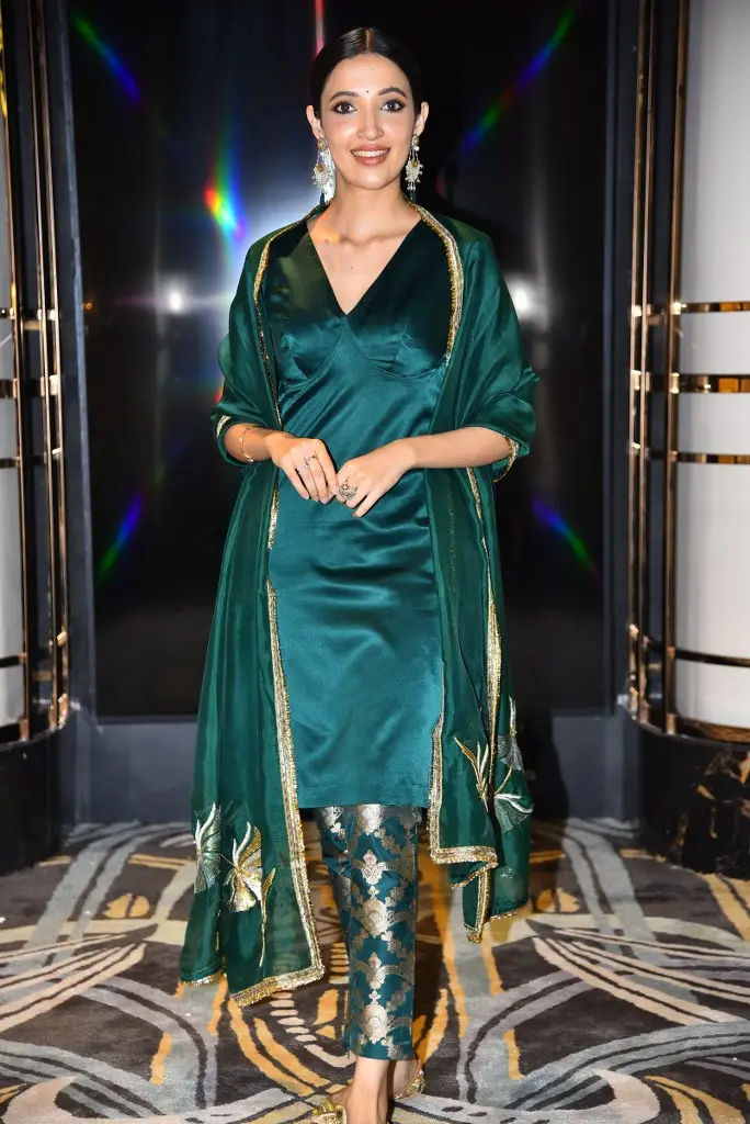 Neha Shetty Adorable Looks in Green Dress at Gangs of Godavari Teaser Launch Event