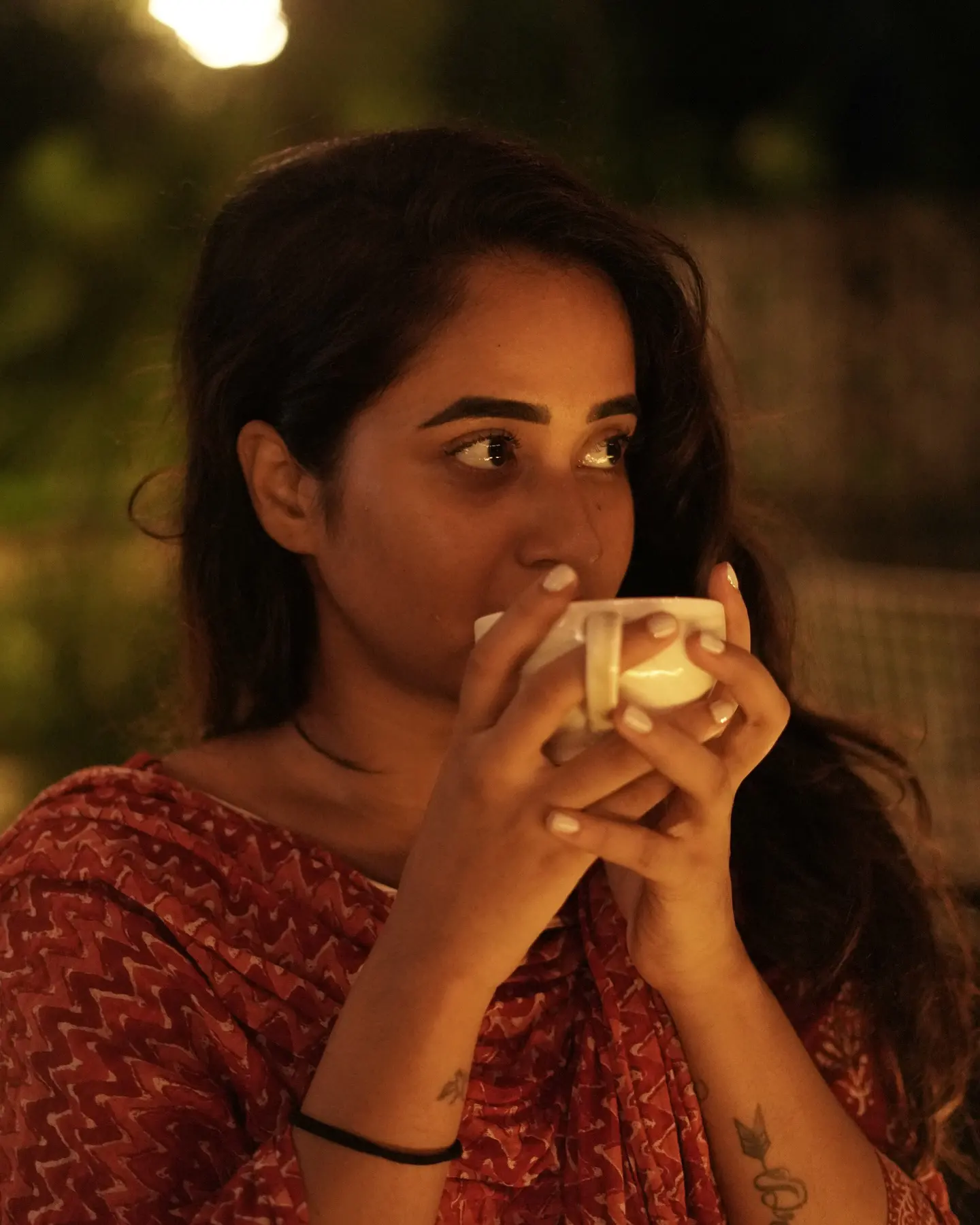 Deepthi Sunaina shines under Umbrella at Night Time