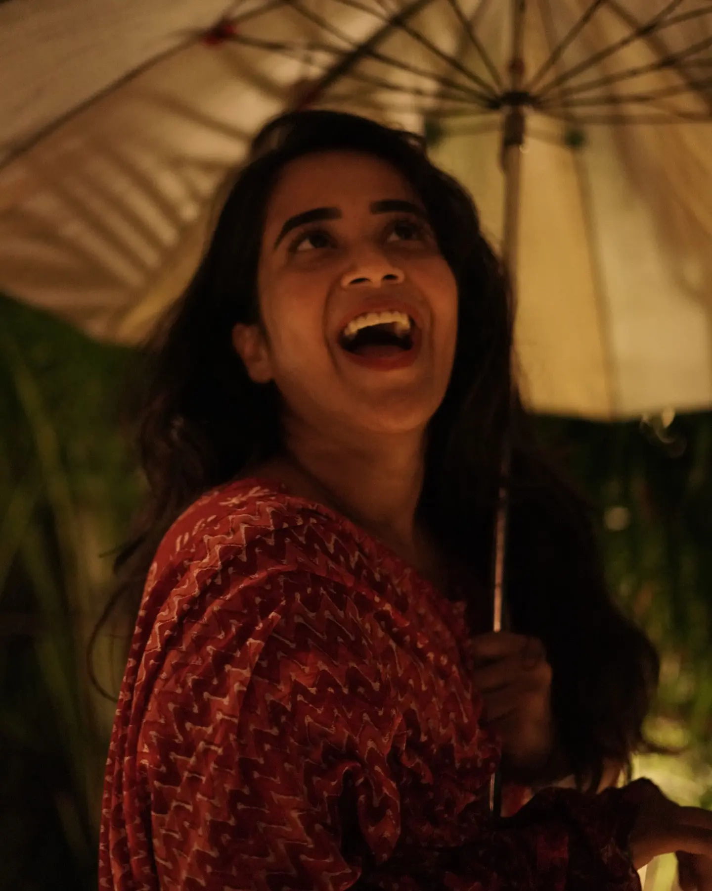Deepthi Sunaina shines under Umbrella at Night Time