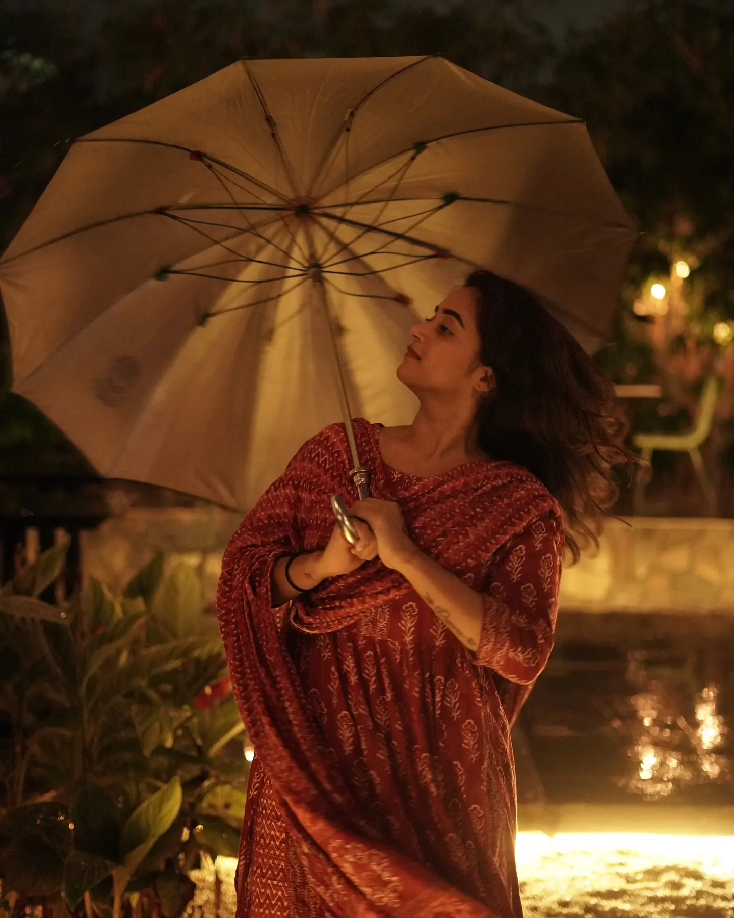 Deepthi Sunaina shines under Umbrella at Night Time