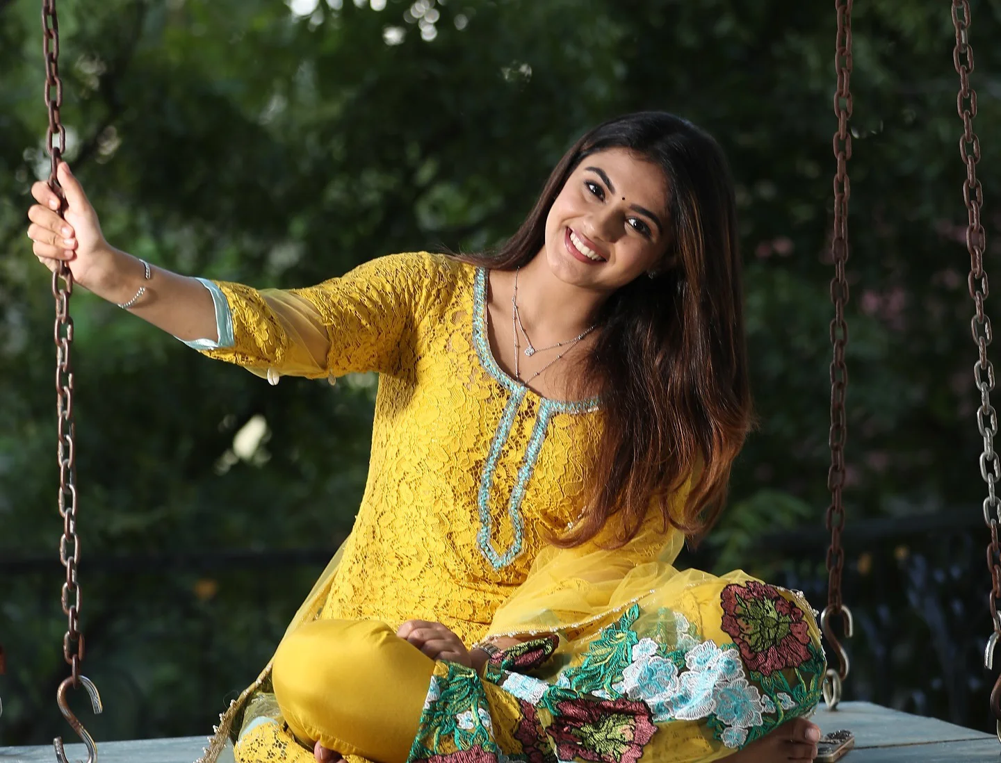 Nayan Sarika Cute Photos on The Cradle