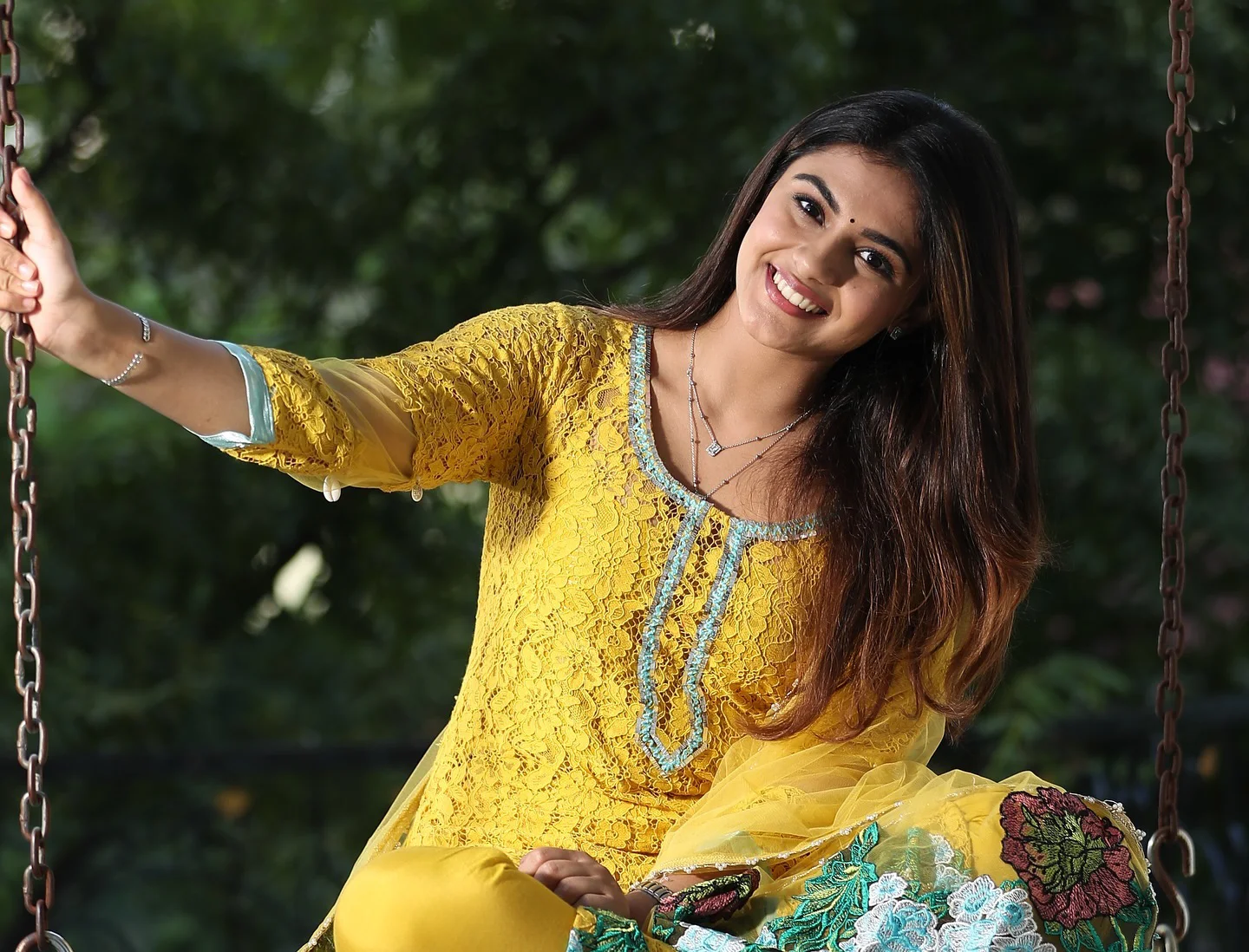 Nayan Sarika Cute Photos on The Cradle