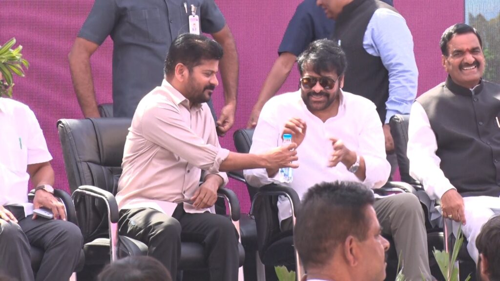 CM Revanth Reddy Gives Water to Megastar Chiranjeevi on Stage Video goes Viral 