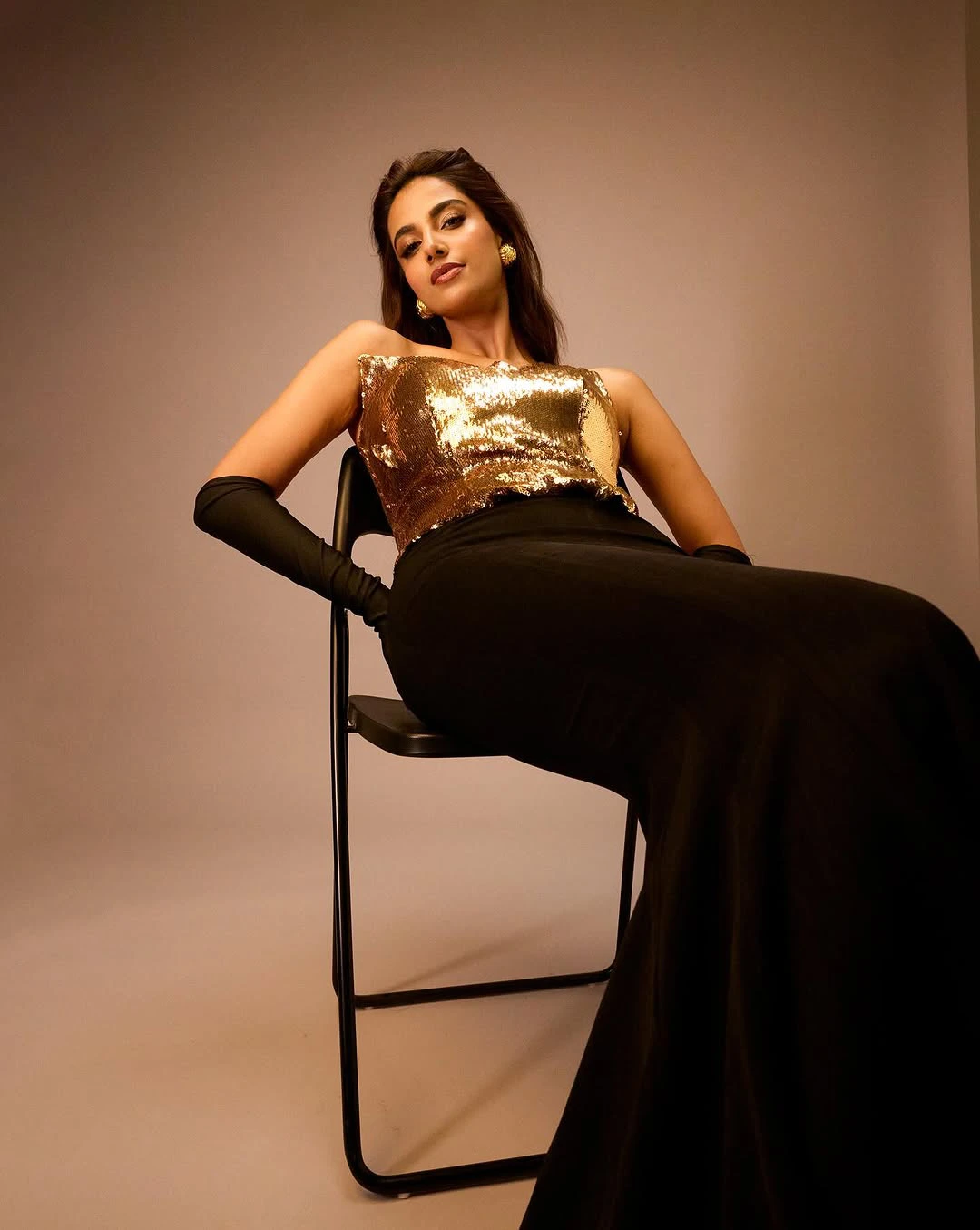 Meenaakshi Chaudhary Shines in Golden Dress