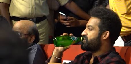 NTR Drinikng a Special Bottle Liquid in Mad Square Success Event 