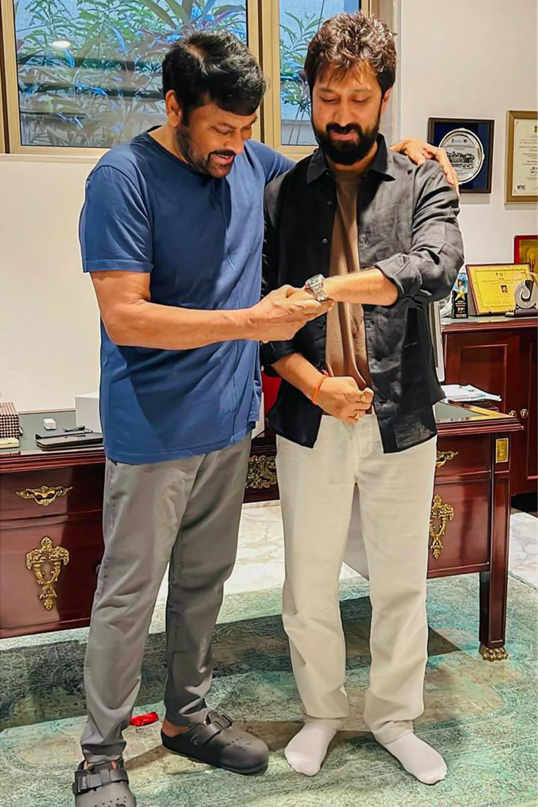 Chiranjeevi Gifterd Watch to Director Bobby