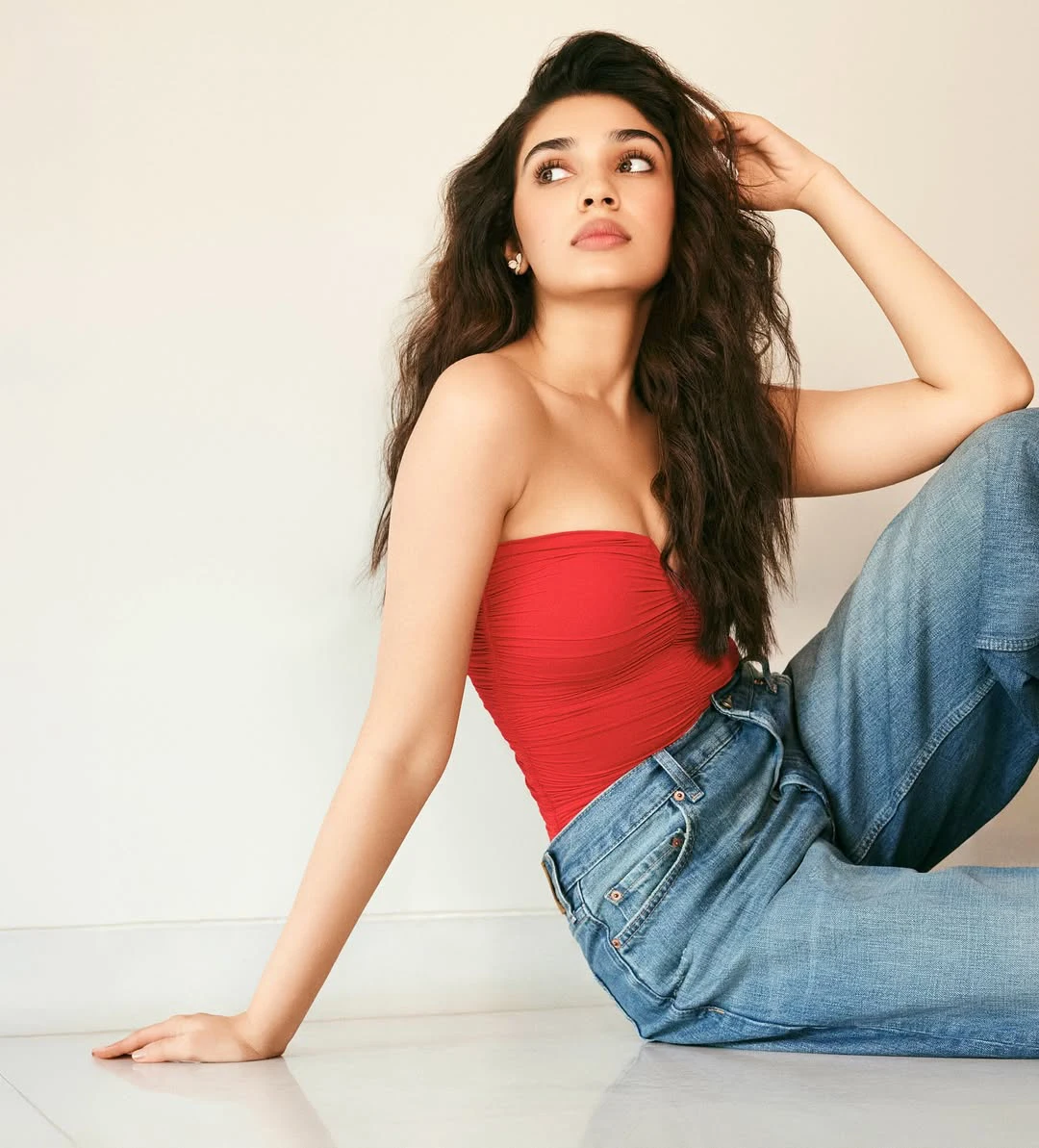 Krithi Shetty Shows her Beauty in Red Top and Blue Jeans