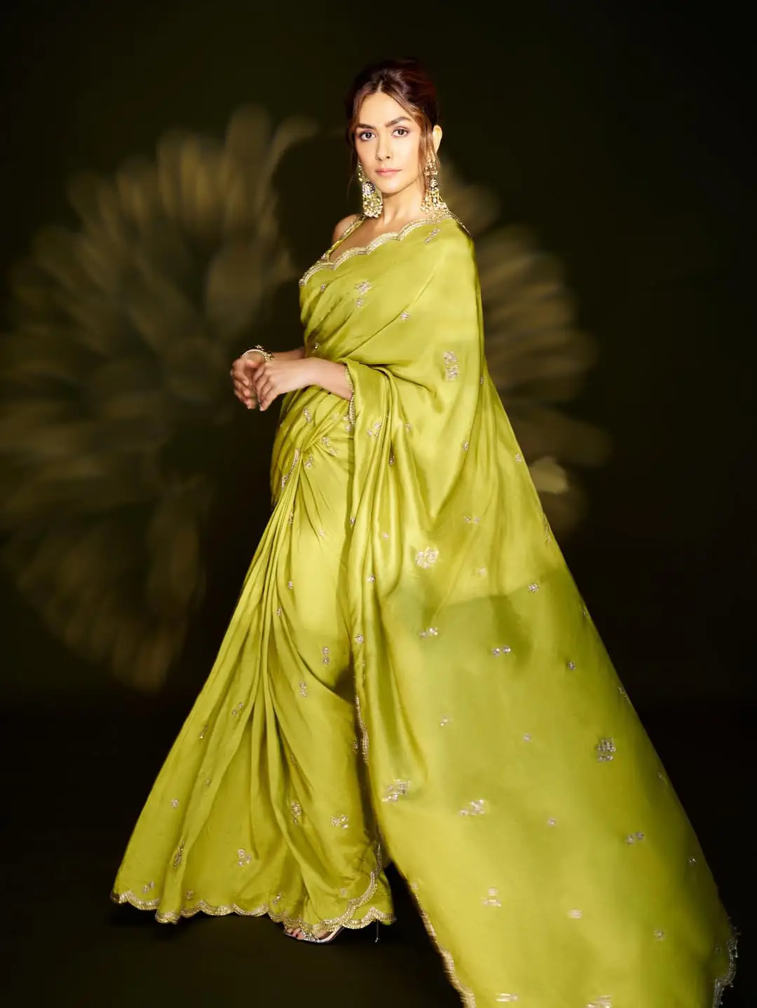 Mrunal Thakur looks stunning in a green saree