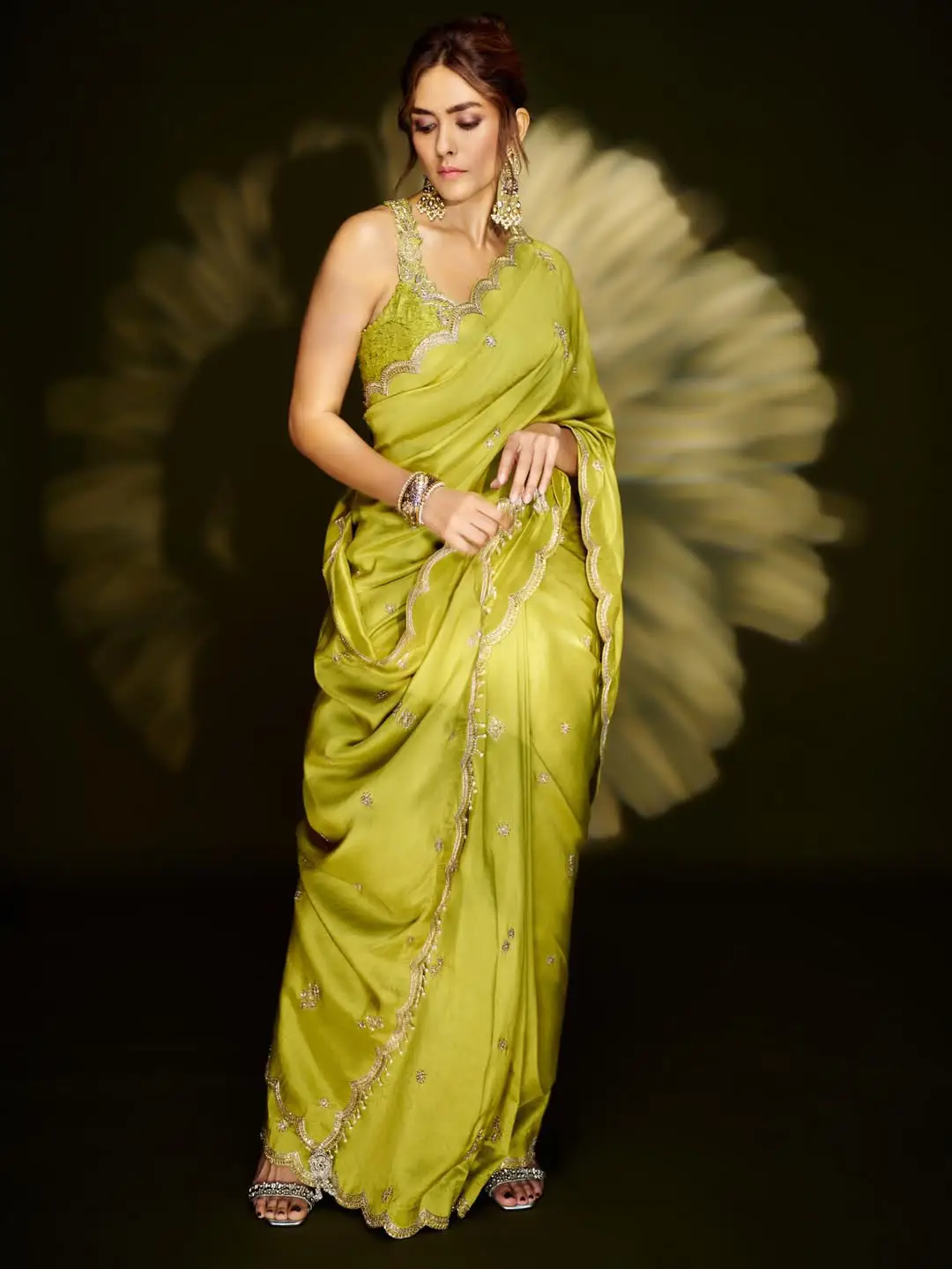 Mrunal Thakur looks stunning in a green saree