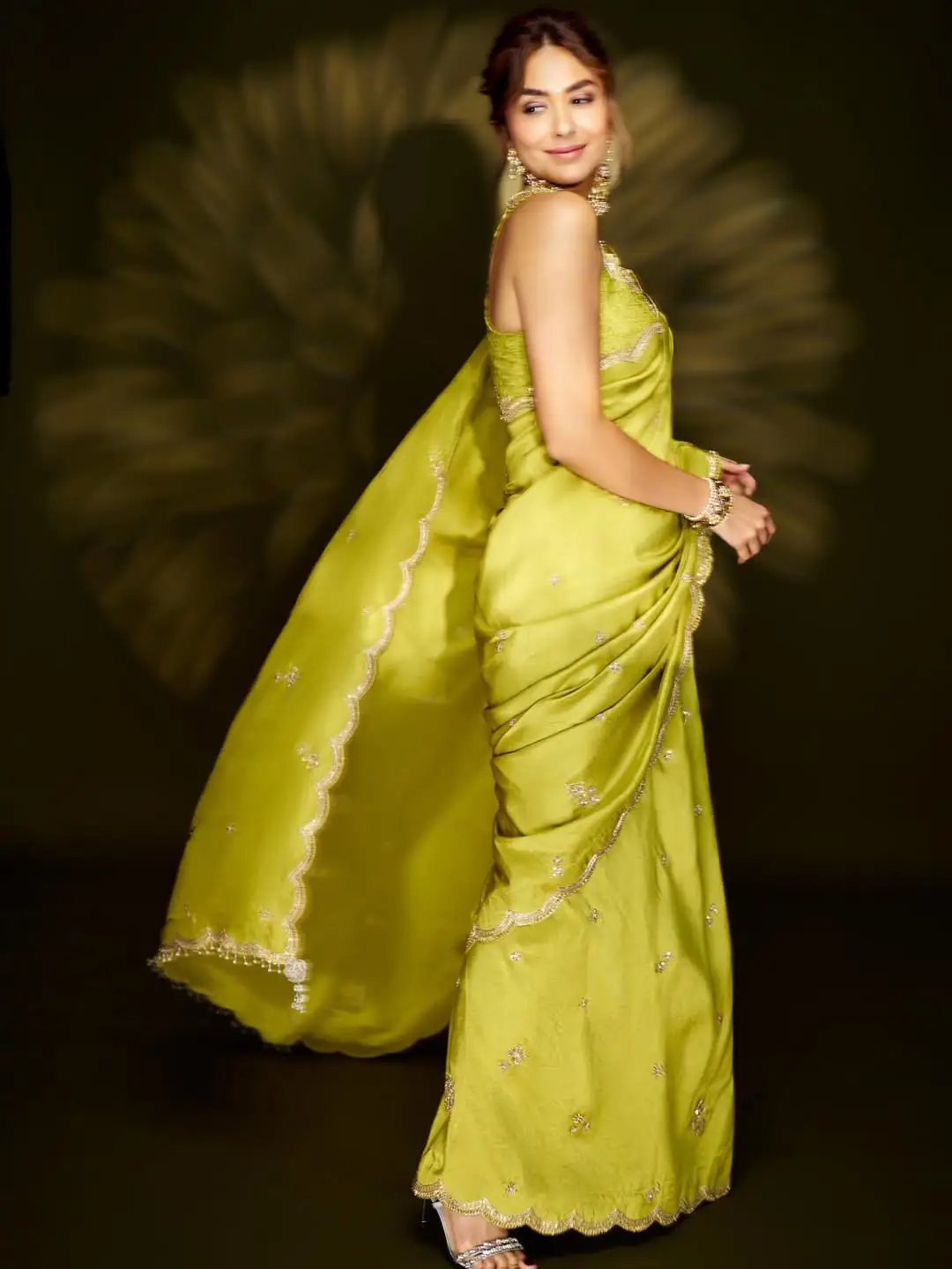 Mrunal Thakur looks stunning in a green saree