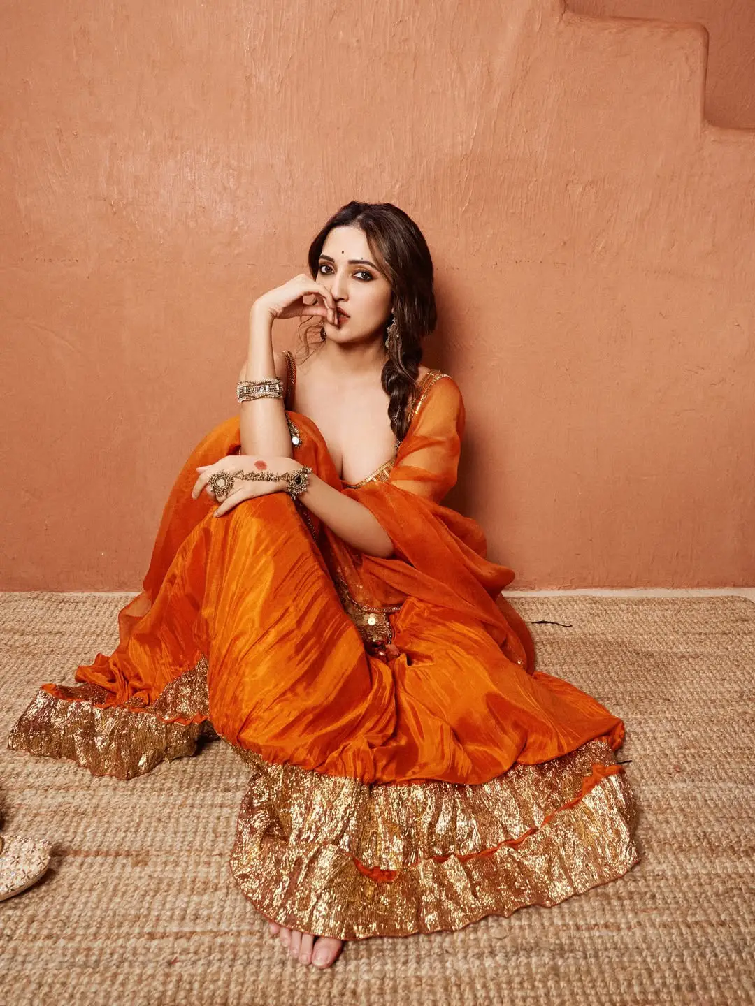 Neha Shetty stunning looks in an orange colour dress