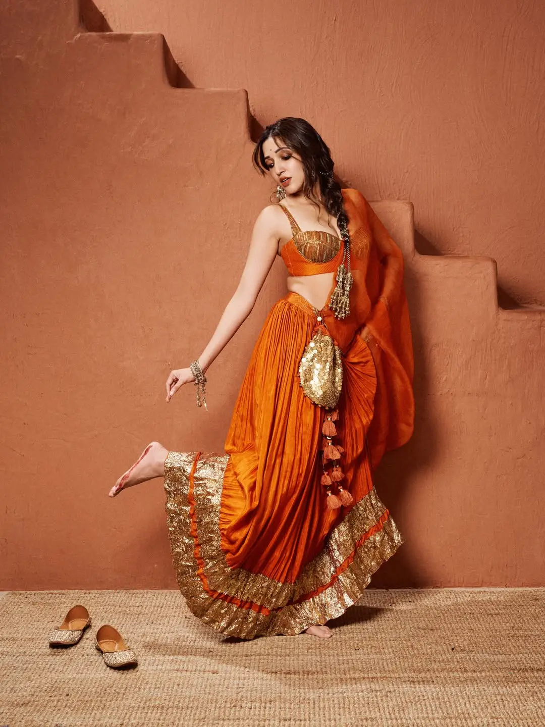 Neha Shetty stunning looks in an orange colour dress