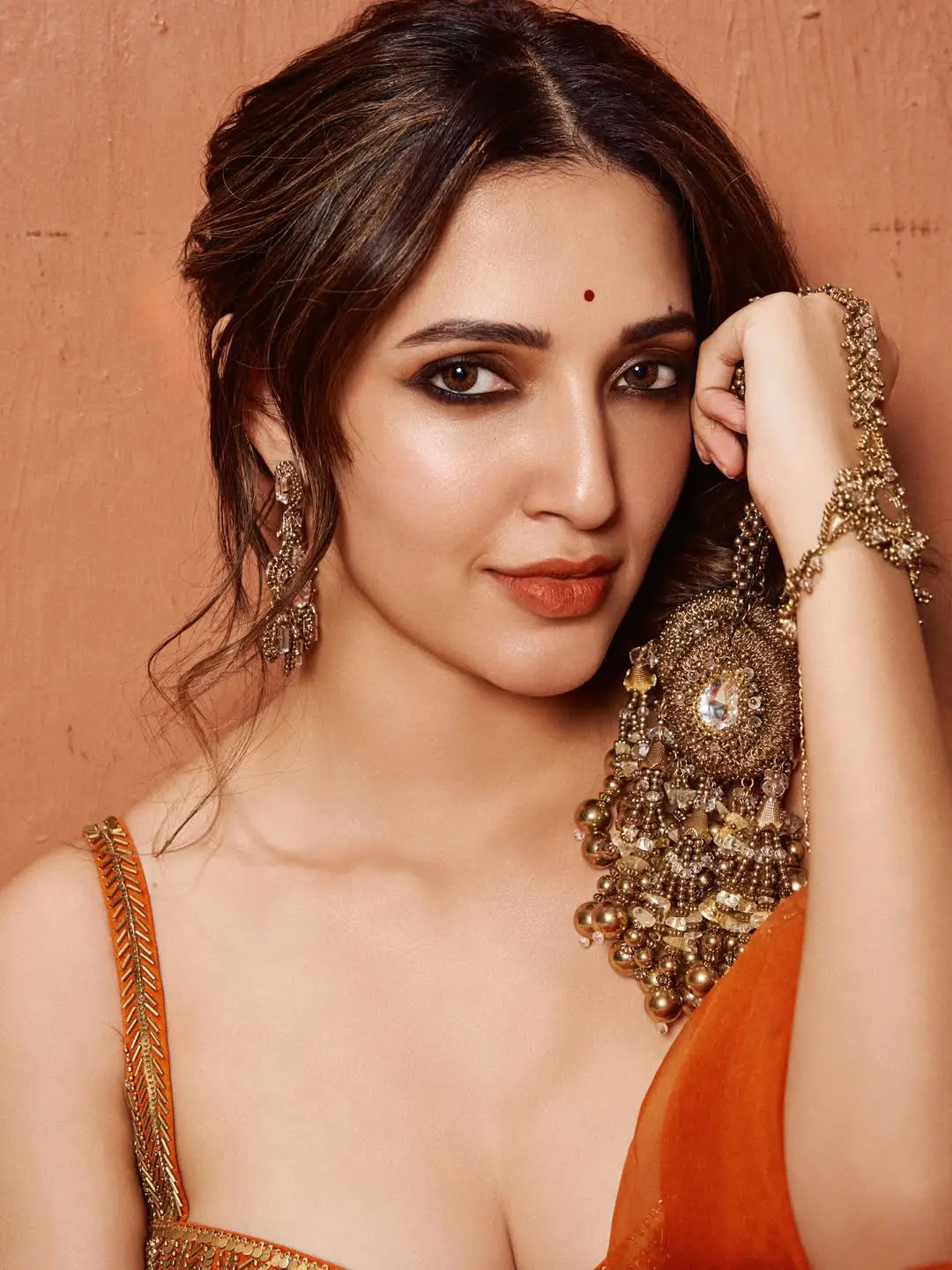 Neha Shetty stunning looks in an orange colour dress
